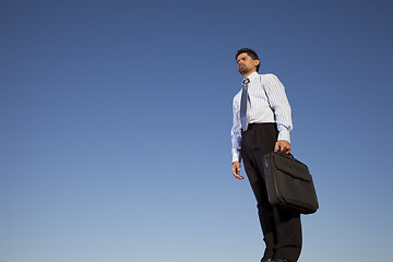 Image showing Powerful businessman holding a briefcase