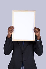 Image showing african businessman holding a whiteboard