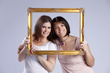 Image showing two woman inside a picture frame