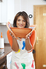 Image showing Woman cooking at her kitchen