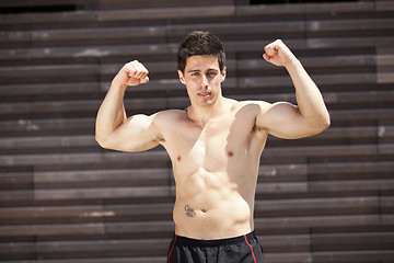 Image showing Athlete showing his muscles
