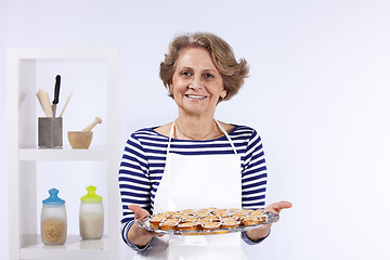 Image showing Senior woman cooking