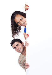 Image showing Multiracial couple holding a blank banner