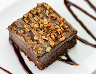 Image showing brownie with chocolate sauce