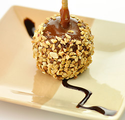 Image showing Candy apple with caramel sauce