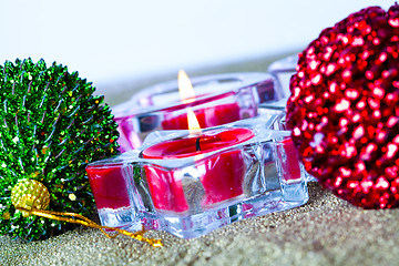 Image showing Christmas baubles and candles