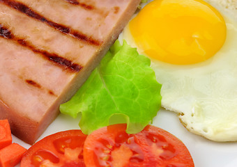 Image showing Sliced grilled ham with egg and vegetables