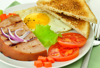 Image showing Sliced grilled ham with egg and vegetables