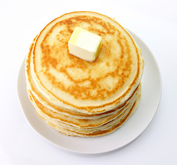 Image showing Golden pancakes with butter