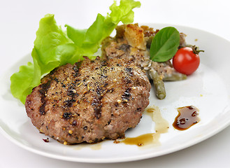 Image showing Juicy grilled hamburger