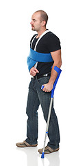 Image showing man with crutch