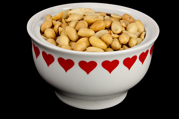Image showing Peanuts in a heart bowl