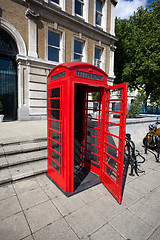 Image showing Old red telephone box in London