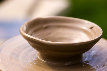 Image showing New pot on potter's wheel