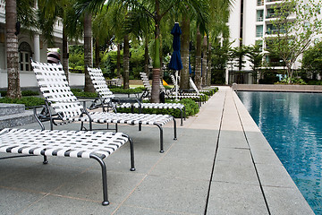 Image showing Swimming pool with chairs