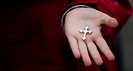 Image showing Cross in child hands 
