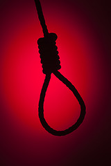 Image showing Silhouetted Hangman's Noose Over Red Background