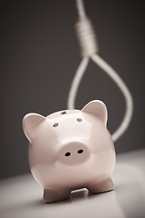 Image showing Piggy Bank with Hangman's Noose in Background