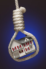 Image showing House Tied Up and Hanging in Hangman's Noose on Blue