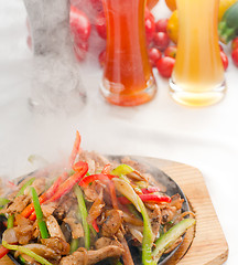 Image showing original fajita sizzling hot  on iron plate