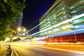 Image showing light trails on modern city at night