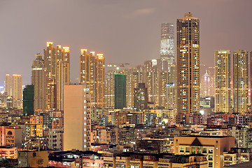 Image showing urban city at sunset with all lights lit up 