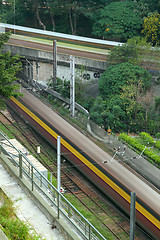 Image showing very high-speed train go through the city