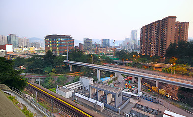 Image showing very high-speed train go through the city