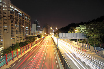 Image showing traffic through downtown at night 