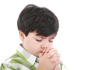 Image showing A boys prays earnestly to his creator in heaven 