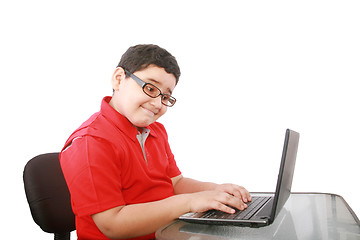 Image showing young boy with computer isolated on white 