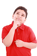 Image showing Child with a pensive expression looking up. Isolated on white ba