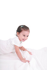 Image showing cute little girl on the bed at home 