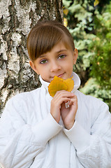 Image showing Girl with leaves