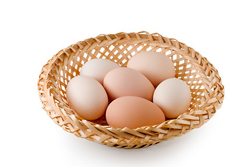 Image showing Eggs lay in a woven basket