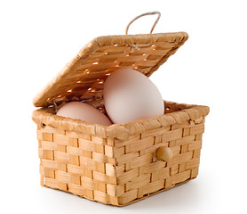 Image showing Eggs lay in a woven basket