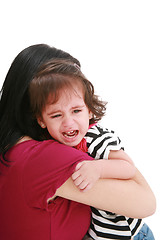 Image showing Little girl crying in mothers arm, isolated on white
