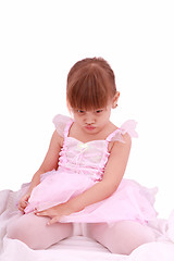 Image showing Full length portrait of a sad little ballerina dressed in pink 