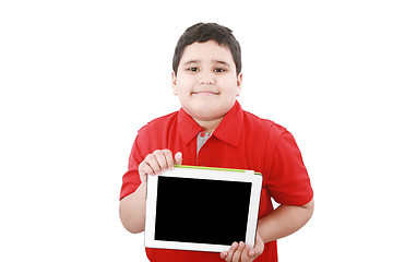 Image showing Young boy holding a tablet computer isolated on white 