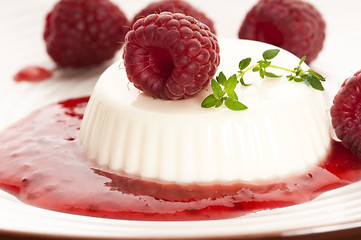 Image showing Vanilla panna cotta with berry sauce