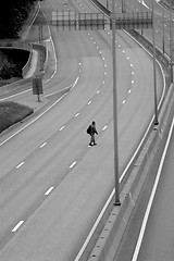 Image showing Man crossing the motorway