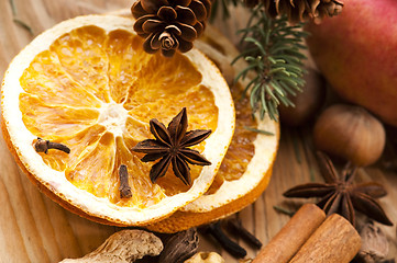 Image showing Different kinds of spices, nuts and dried oranges - christmas de