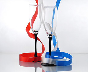 Image showing colorful  streamers and two empty glasses