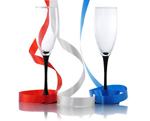 Image showing colorful  streamers and two empty glasses