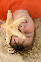 Image showing Child with a large starfish
