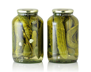 Image showing Glass jars with pickled cucumbers 