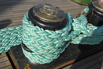 Image showing Green Rope Rolled On Bollard