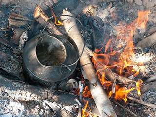 Image showing Kettle with boiling water on an open fire