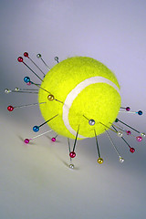 Image showing tennis ball on needles