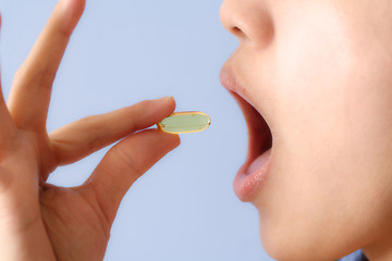 Image showing Taking a pill